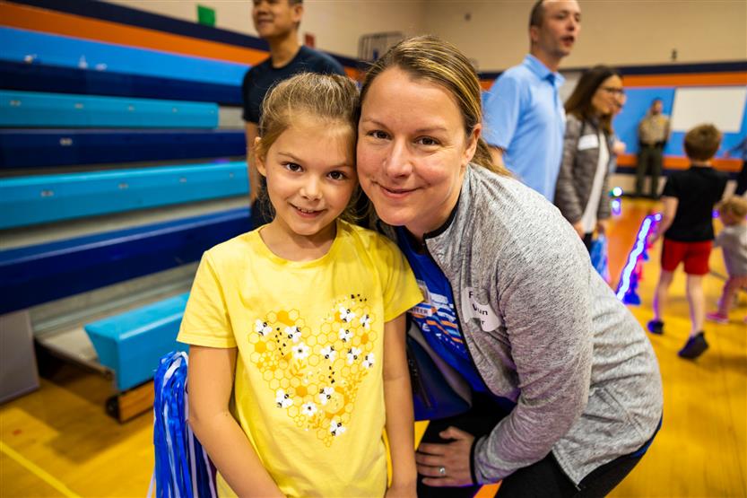 Students and families participate in a fun run